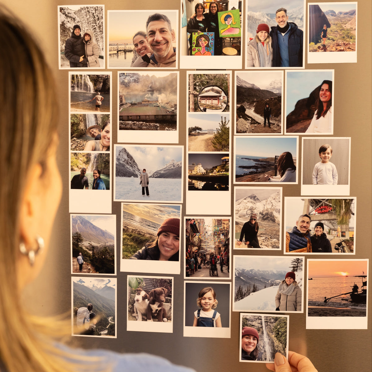 Large personalised photo magnets displayed in a lifestyle setting