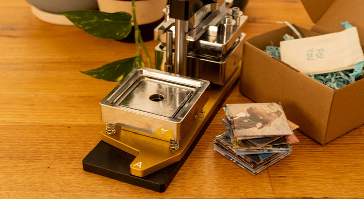 Personalised pressed photo magnets displayed in a lifestyle setting